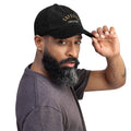 Man wearing a black coffee shop cap with state of mind txt