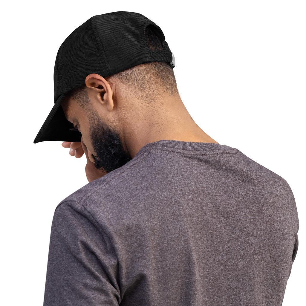 Man wearing a black coffee cap and gray shirt ready for the coffee shop