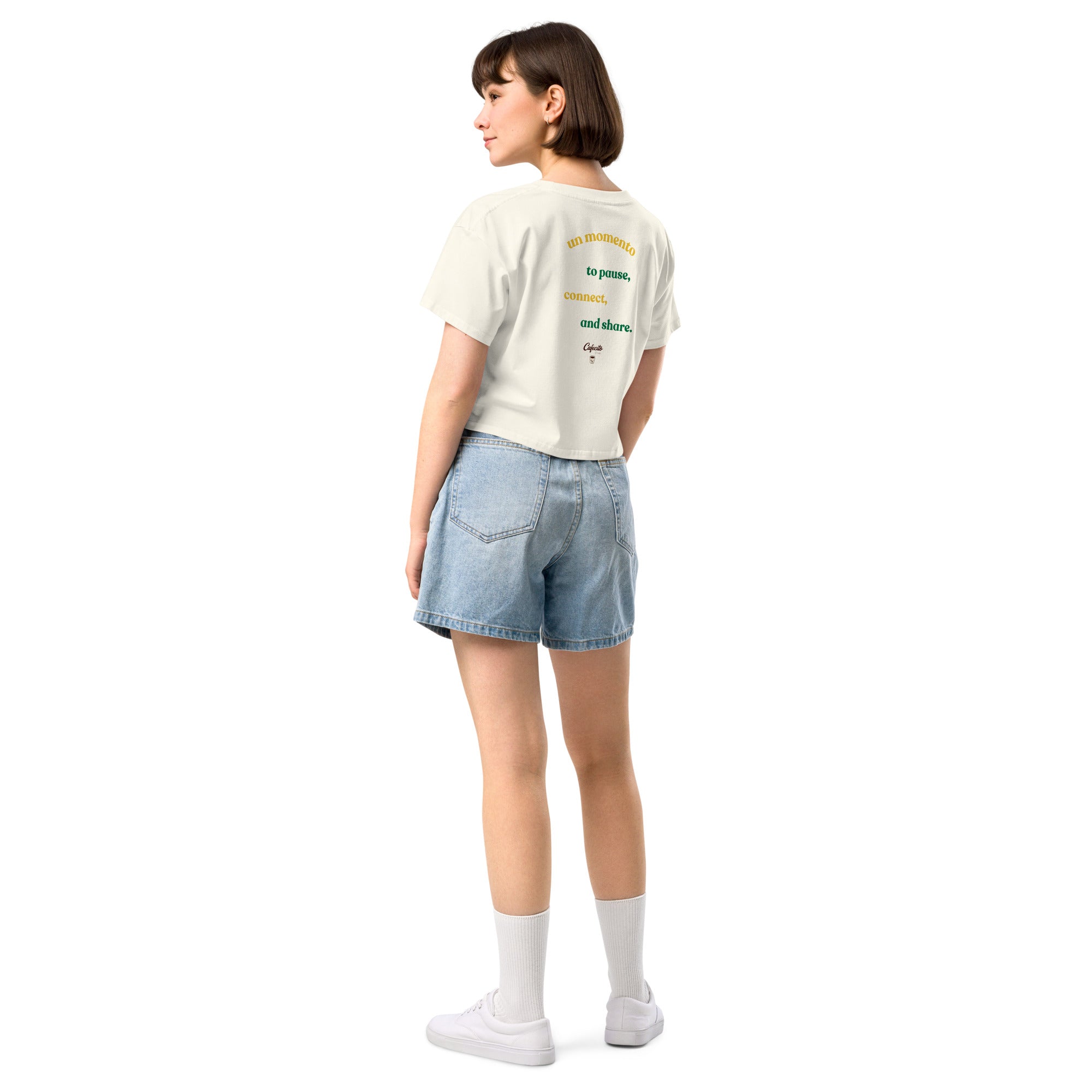 women wearing a coffee t shirt and wearing denim shorts.