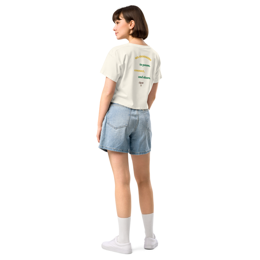 Person wearing a white coffee t-shirt with cafecito text and denim shorts 